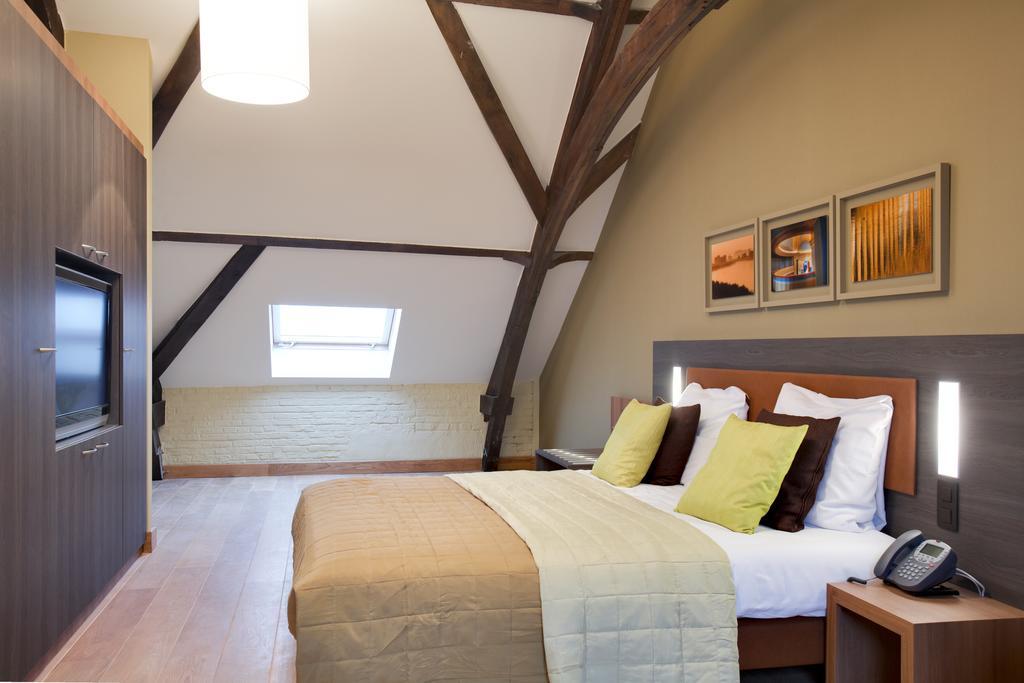 Het Godshuis Hotel Sint-Laureins Bilik gambar